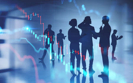 Silhouettes of business people working together in blurry abstract office with double exposure of financial graphs. Toned imageの写真素材