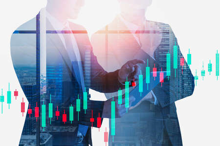 Silhouettes of two businessmen working together in blurry panoramic office with double exposure of...