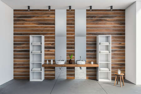 Interior of modern bathroom with white and wooden walls, concrete floor and comfortable double sink...