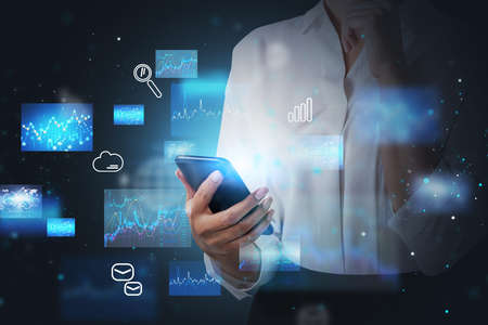 Hands of businesswoman using smartphone near black wall with double exposure of blurry immersive...