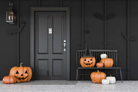Carved pumpkins, bats and spiders near black front door of modern house with black walls and black bench. Concept of halloween. 3d renderingの写真素材