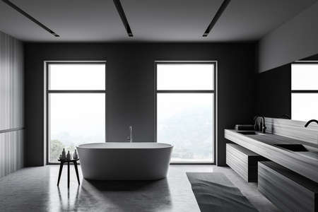 Side view of stylish bathroom with gray and wooden walls, concrete floor, comfortable bathtub and...