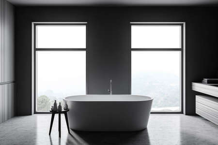 Interior of stylish bathroom with gray and wooden walls, concrete floor, comfortable bathtub and windows with blurry view. 3d renderingの写真素材
