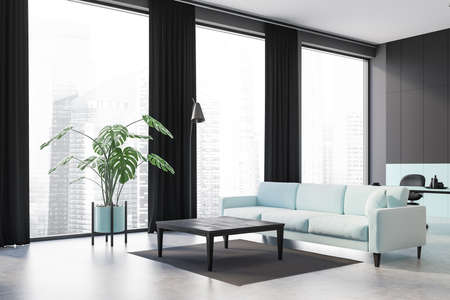 Corner of stylish living room with black and green walls, concrete floor, green sofa and coffee...