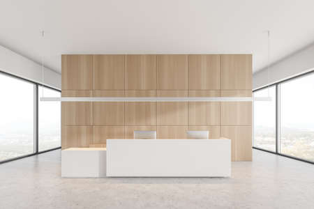 Long white reception desk with two computers standing in modern office with white and wooden walls and concrete floor. 3d renderingの写真素材