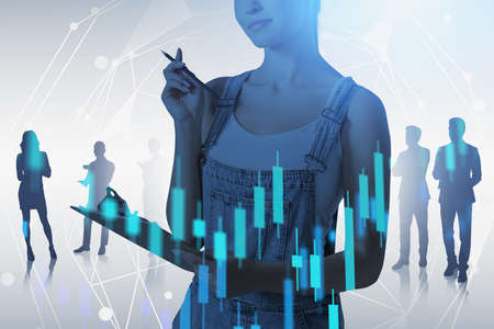 Smiling young European businesswoman standing with her team over blue background with double exposure of financial chart. Toned imageの写真素材