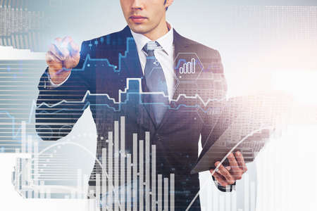 Unrecognizable businessman with clipboard working with financial chart in blurry city. Toned image...