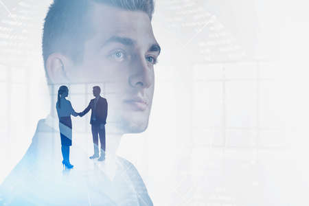 Man and woman shaking hands, thoughtful businessman