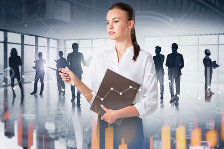 Serious young businesswoman with folder standing with her team in office with double exposure of...