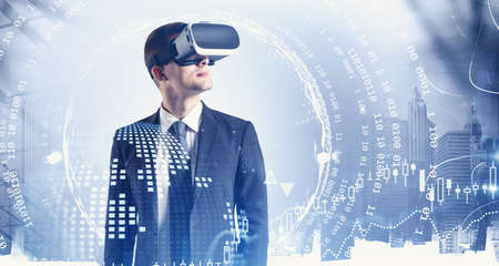 Portrait of young European businessman in VR glasses standing in blurry city. Concept of hi tech and...