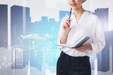 Unrecognizable thoughtful businesswoman standing with planner in blurry city with double exposure of...