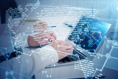 Hands of businessmen using laptops in blurry office with double exposure of immersive network...