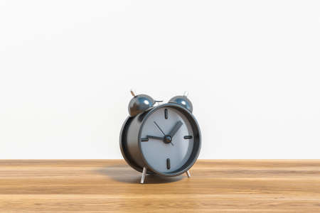 Traditional alarm clock standing on wooden table over white background. Concept of waking, time...