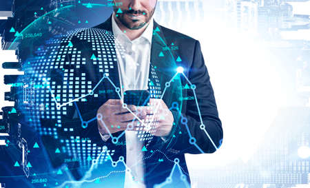 Unrecognizable businessman using smartphone in blurry office with double exposure of network...