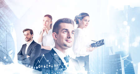 Portrait of four successful business people working together in blurry city with double exposure of charts. Toned imageの写真素材