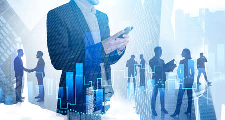 Unrecognizable businessman with smartphone working in blurry city with his team and double exposure...