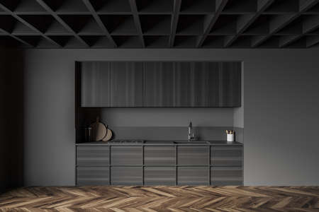 Interior of stylish kitchen with gray and dark wooden walls, wooden floor and wooden cupboards. 3d renderingの写真素材