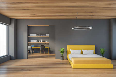 Open space bedroom with wooden and gray design, big yellow with linens and plants. Workplace with shelves and two chairs on background, 3D rendering no peopleの写真素材