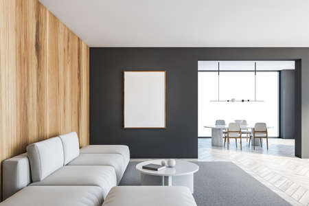 Mockup blank canvas in gray wooden living room with white sofa, coffee table. Dining room on background with big window, gray wooden floor 3D rendering no peopleの写真素材