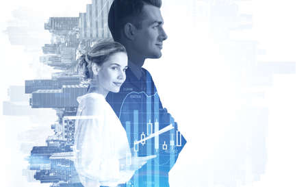 Portrait of businessman and businesswoman in blurry city. Concept of partnership and teamwork. Toned...