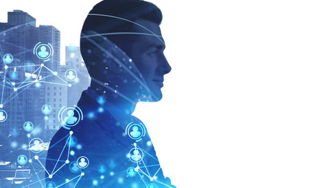 Portrait of confident young businessman standing in blurry city with double exposure of HR...