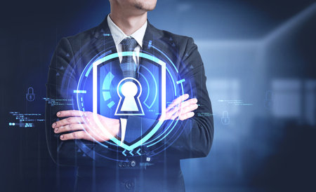 Confident young businessman standing in blurry office with double exposure of cyber security...