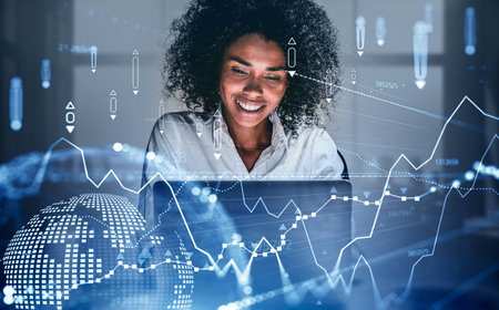 Young African American businesswoman working in blurry office with double exposure of planet...