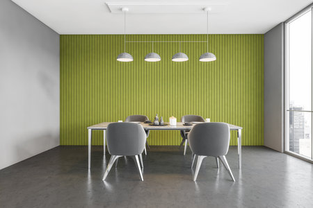 Interior of stylish dining room with green and gray walls, concrete floor and table with gray chairs. 3d renderingの写真素材