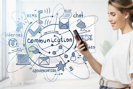 Side view of young woman using smartphone in blurry room with double exposure of creative communication sketch. Toned imageの写真素材