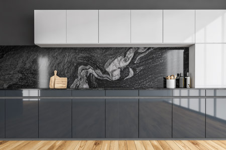 Black and white kitchen set with appliances and stove, parquet floor, front view. Modern minimalist kitchen set with marble decoration, 3D rendering no peopleの写真素材