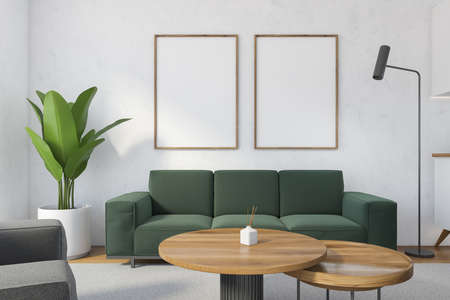 Mockup canvas frames in white living room with green sofa and coffee table on gray carpet, parquet...
