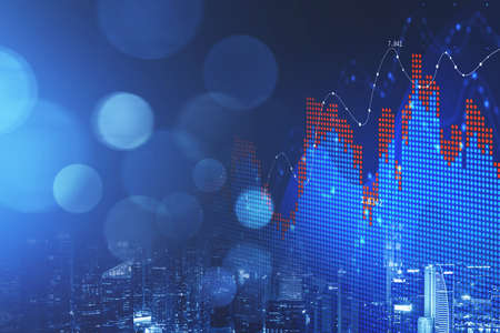 Concept of stock market and fintech forex concept. Blurry blue digital charts over dark blue...