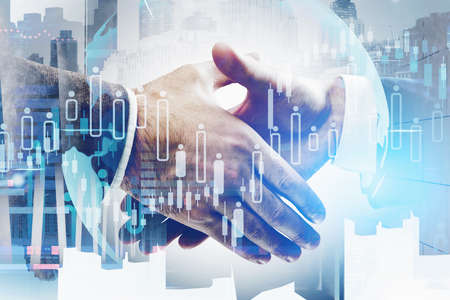 Concept of partnership. Business man handshake over global world map and forex chart. Capital and...