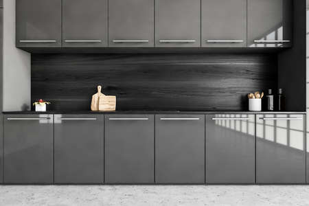 Black and gray minimalist kitchen set with appliances and stove, front view. Dark luxury kitchen on marble floor, 3D rendering no peopleの写真素材