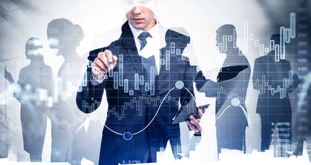 Trader is carrying out a research of historic data of stock market behavior by pointing to hologram...