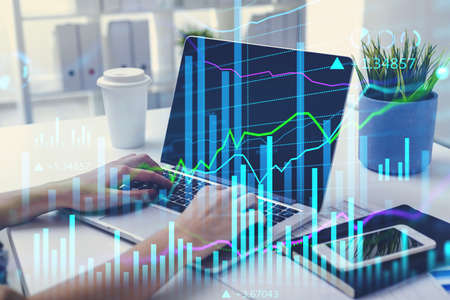Businesswoman or stock trader analyzing stock market graph chart, side view business woman using...