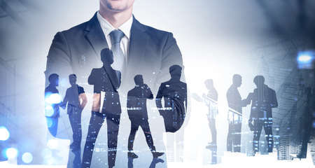 Silhouettes of business people working at corporate office in downtown. Work hard and business development concept. Double exposureの写真素材