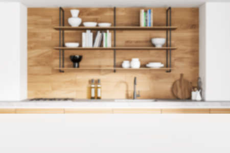 Empty white wooden table perspective for product placement or montage with focus to table. Blurry interior of modern kitchen with kitchenware, books, sink, stove. 3d rendering. Close upの写真素材