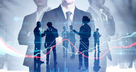 Silhouettes of three businesspeople working and researching the analytics to predict stock market...