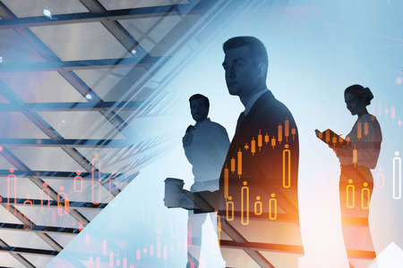 Businessmen working together, double exposure with graphs glowing, office room. Concept of network and stock market changes. Toned imageの写真素材