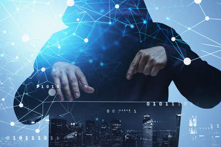 Front view of hacker attacking information and servers at night. New York city on background. Internet, innovation and cyber attack, double exposureの写真素材