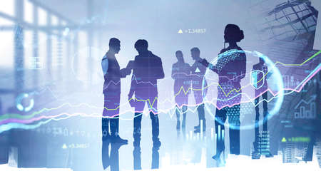 Group of businesspeople working and researching the analytics to predict stock market behavior....