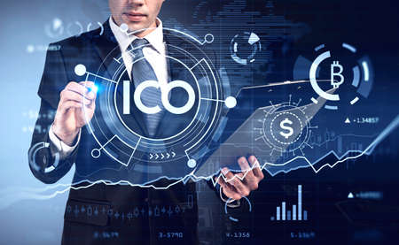 Businessman using his planner checking the ICO agenda of upcoming cryptocurrency meet up. Financial...