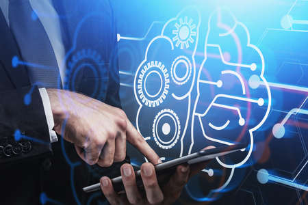 Manager in suit with electronic device in hands, drawing of human brain. Corporate network and...
