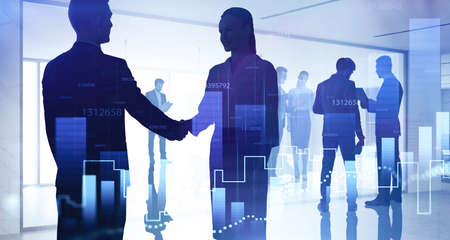Business people shake hands, double exposure of social network and graph changes. Blue interior of...