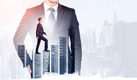 Young businessman climbing bar chart, double exposure with office buildings and business suit. Concept of professional growth, career and stock marketの写真素材