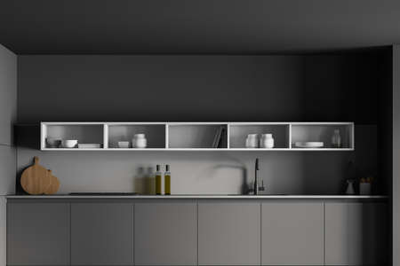 Dark gray minimalist kitchen set with appliances and shelves, front view. Gray luxury kitchen with white and gray design, sink, dishes and cutting board, 3D renderingの写真素材