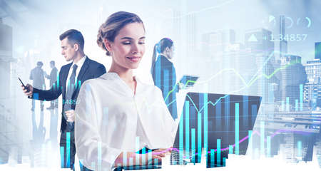 Businesswoman with laptop, businessman with phone in hand. Financial advisor, traders on background of skyscrapers and bar chart with numbers. Concept of finance and stock marketの写真素材