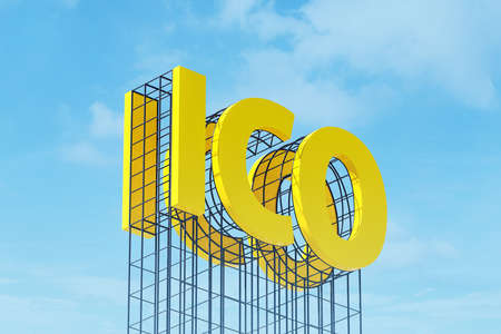 Large yellow signboard on metal frame with the word ICO. Clear sky in the background. Concept of capital formation and investment in cryptocurrency, advertising using billboardの写真素材