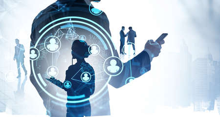 Office people silhouettes, blue hologram with data information, double exposure with skyscrapers. Concept of manager in global communication and technologyの写真素材